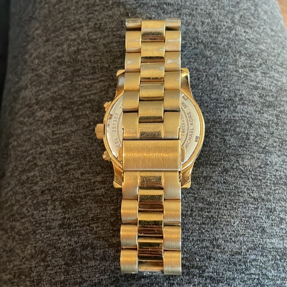 Gold watch with Turquoise face. Good condition